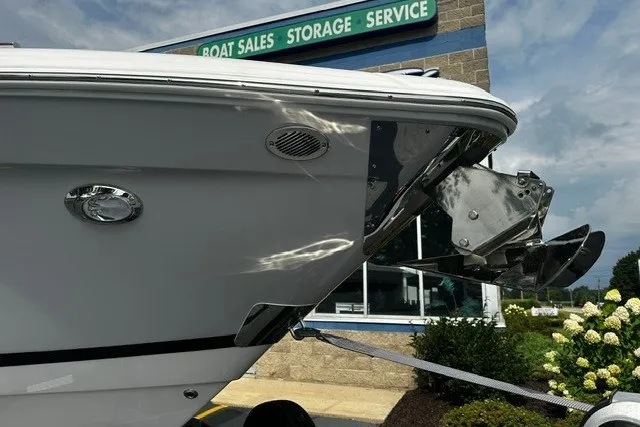 Slide: The Image of 2027 Regal 3300 boat at sales and service center, showcasing sleek design and anchor. - 3
