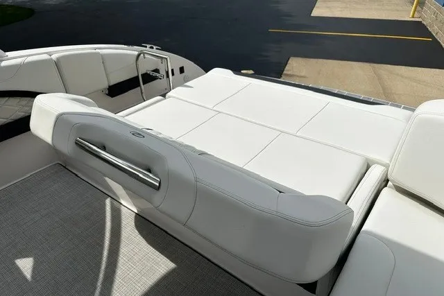 Slide: The Image of Luxurious seating on a 2027 Regal 3300 boat, featuring sleek white upholstery. - 25