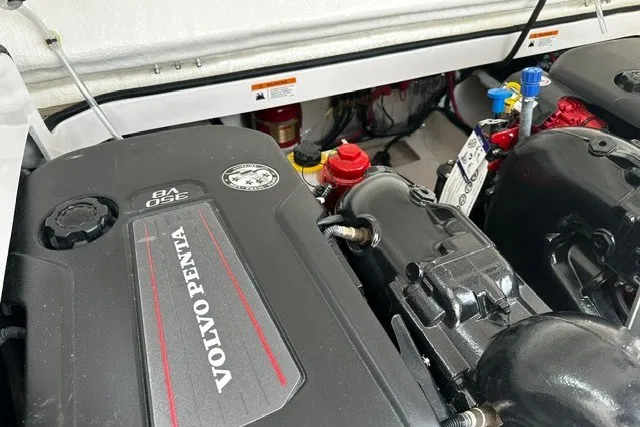 Slide: The Image of Engine compartment of a 2027 Regal 3300 boat featuring a Volvo Penta V8 engine. - 40