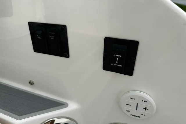 Slide: The Image of Control panel of a 2027 Regal 3300 boat with power and audio controls. - 41