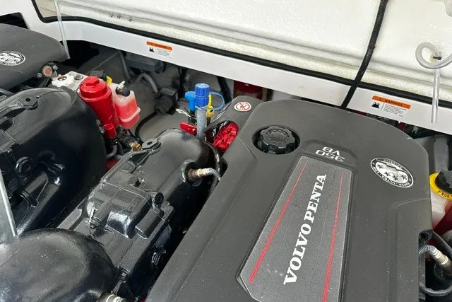 Slide: The Image of Engine compartment of a 2027 Regal 3300 boat featuring a Volvo Penta V8 engine. - 39