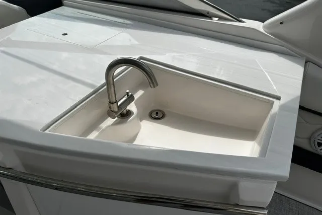 Slide: The Image of Stainless steel sink on 2027 Regal 3300 boat deck, featuring modern design. - 21