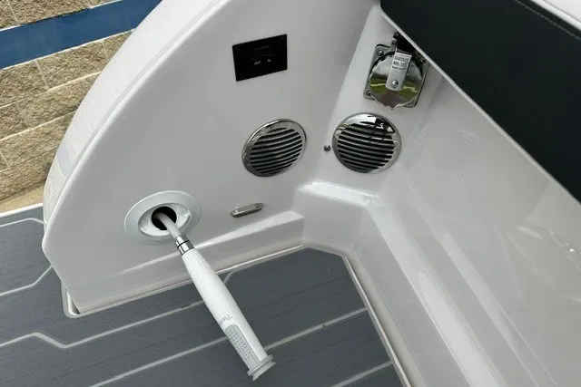 Slide: The Image of 2027 Regal 3300 boat interior with speakers and a retractable shower handle. - 43