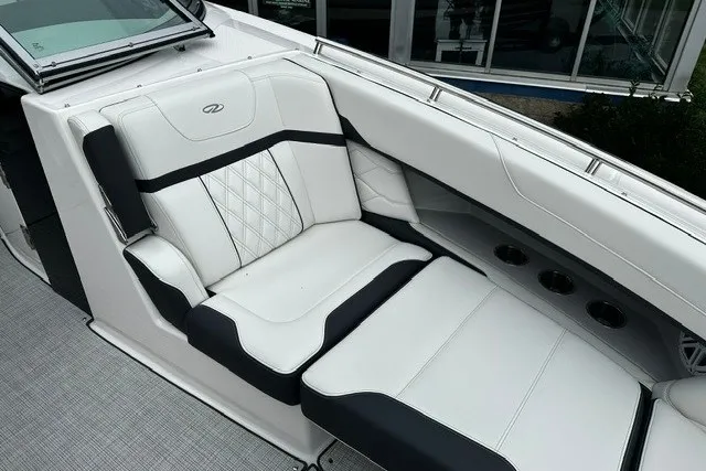 Slide: The Image of Luxurious seating on a 2027 Regal 3300 boat, featuring elegant white and black upholstery. - 31