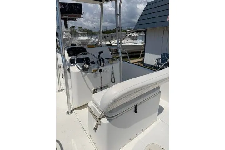 Slide: The Image of 2013 Boston Whaler 21 Montauk boat interior with steering console and seating. - 30