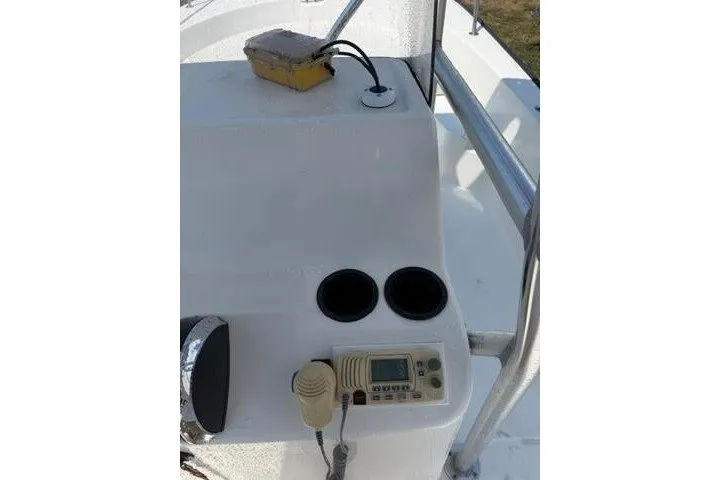 Slide: The Image of 2013 Boston Whaler 21 Montauk console with controls and equipment. - 23