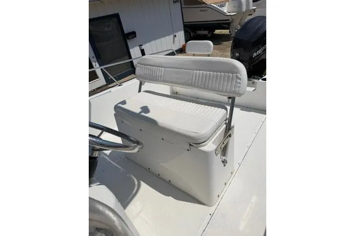 Slide: The Image of 2013 Boston Whaler 21 Montauk boat seat and console in sunlight. - 13