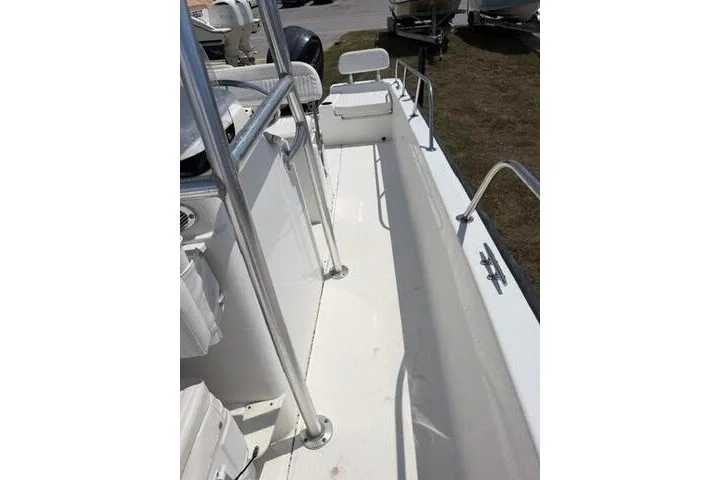 Slide: The Image of 2013 Boston Whaler 21 Montauk boat interior with seating and railings. - 10