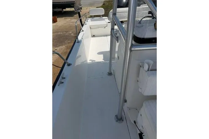 Slide: The Image of 2013 Boston Whaler 21 Montauk boat interior with seating and railing. - 9