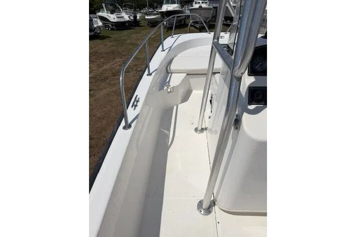 Slide: The Image of 2013 Boston Whaler 21 Montauk boat deck with railing and console. - 25