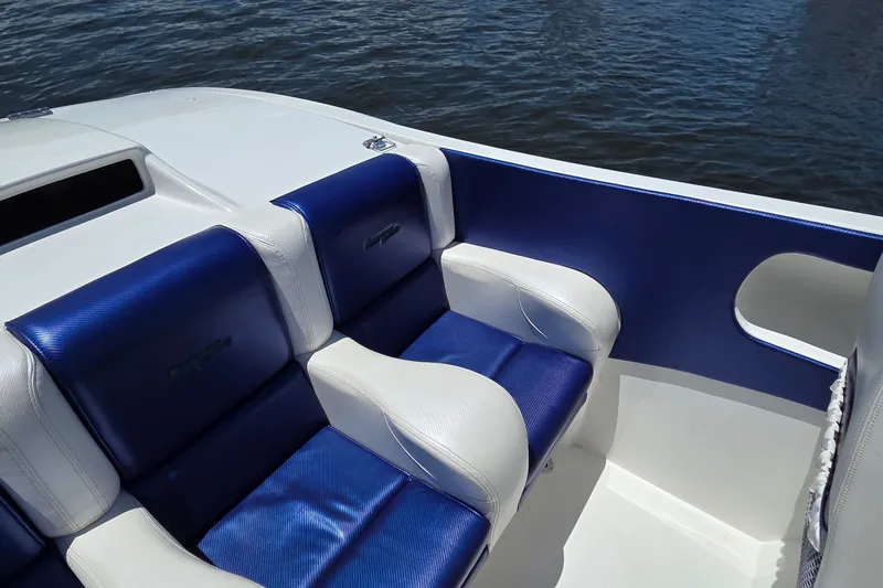 Slide: The Image of Luxury seating on 2021 Activator 30 boat with blue and white upholstery. - 14