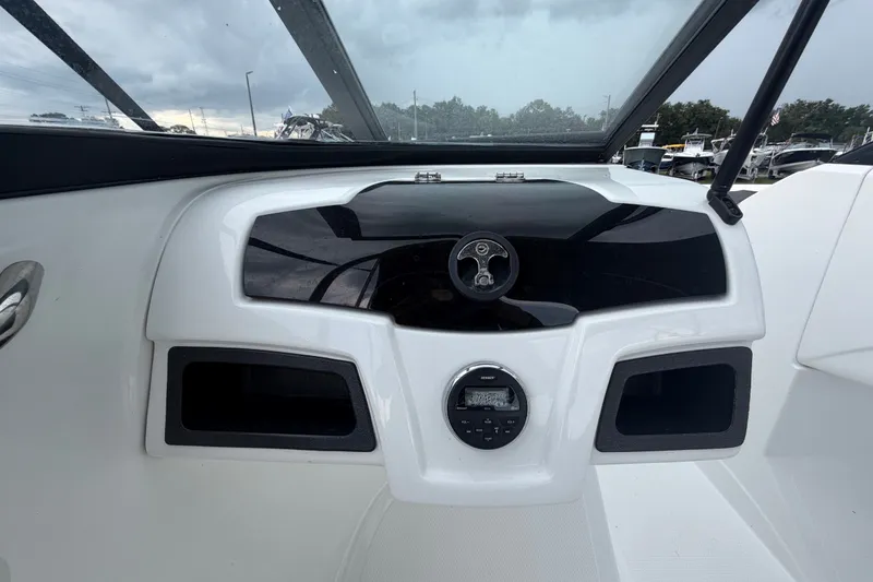 Slide: The Image of Dashboard of a 2019 Tahoe 550 TS boat with steering wheel and controls. - 20