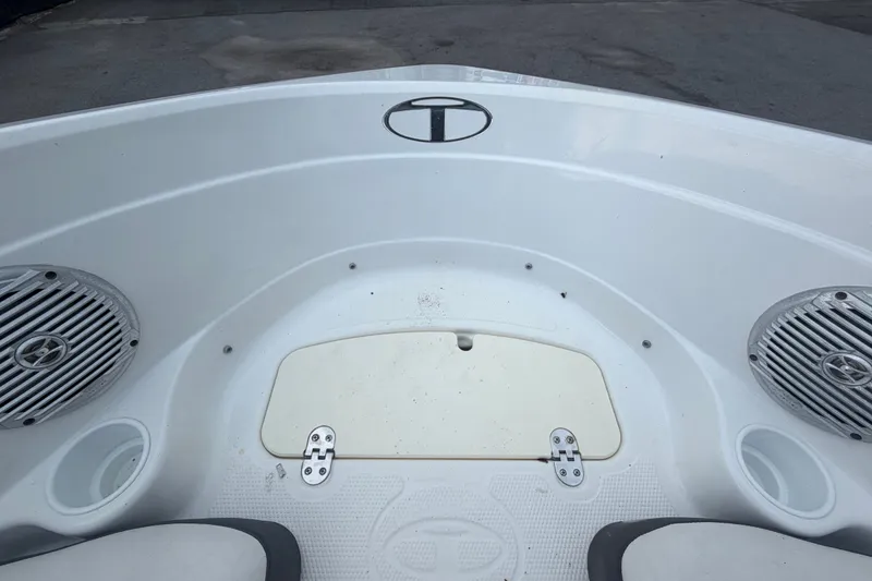 Slide: The Image of 2019 Tahoe 550 TS boat interior with speakers and storage compartment. - 35