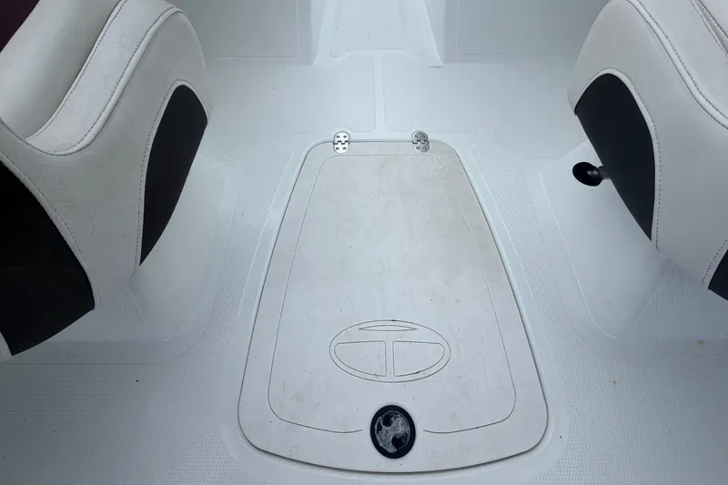 Slide: The Image of Interior of a 2019 Tahoe 550 TS boat showing seating and storage compartment. - 16
