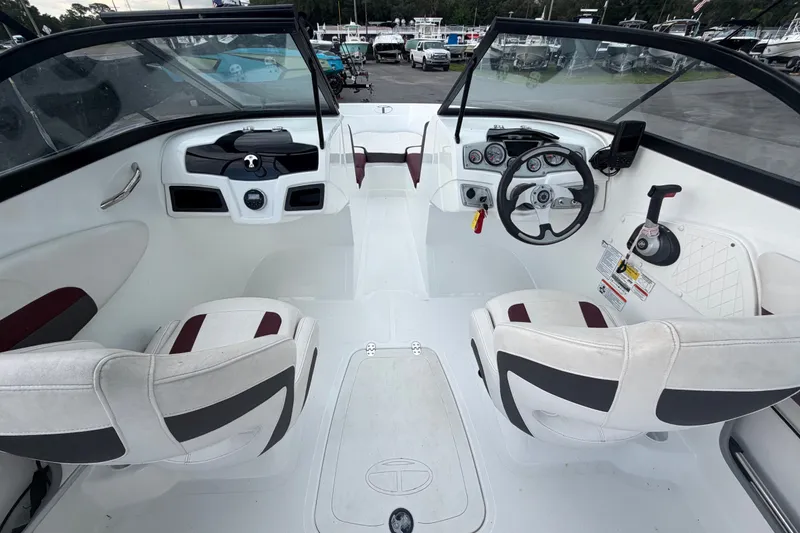 Slide: The Image of Interior of a 2019 Tahoe 550 TS boat with dual seating and control panel. - 15