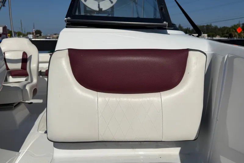 Slide: The Image of 2019 Tahoe 550 TS boat interior with maroon and white seating. - 45