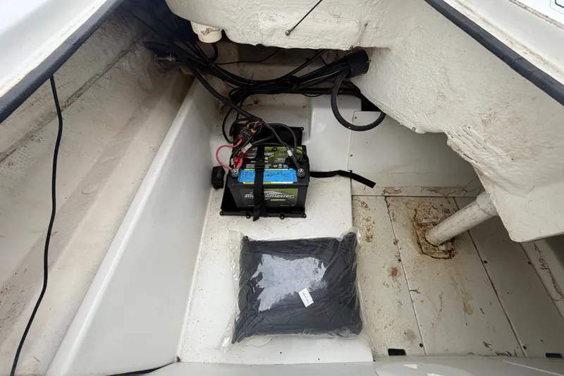 Slide: The Image of 2019 Tahoe 550 TS boat interior showing battery compartment and wiring. - 60