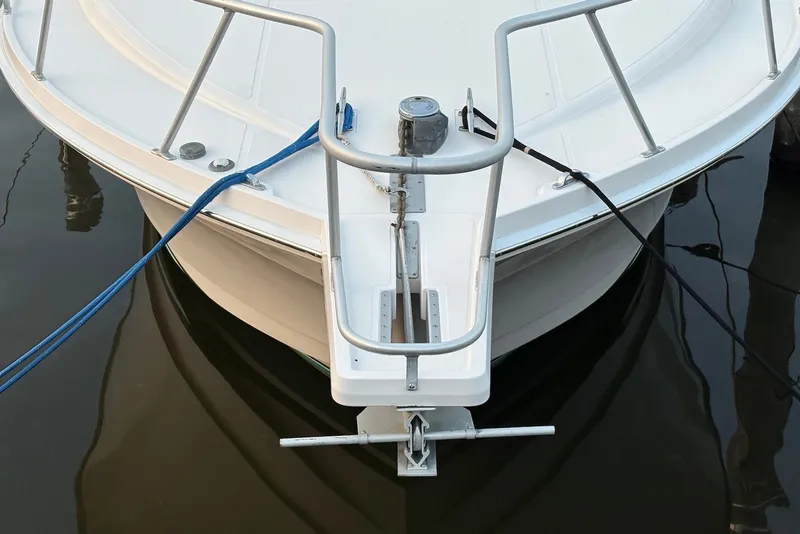 Slide: The Image of Bow of 2002 Cabo 31 Express boat with anchor and mooring lines. - 4