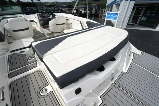 Slide: The Image of 2018 Sea Ray SPX 210 boat interior with seating and dashboard view. - 18