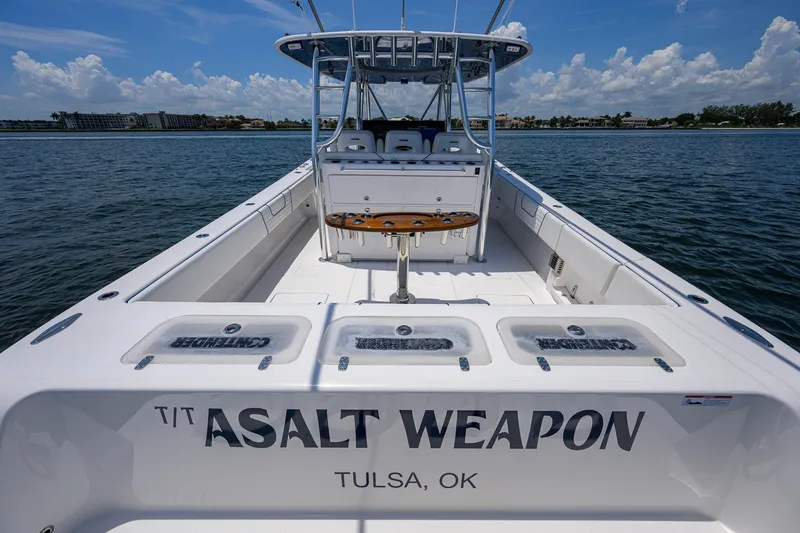Slide: The Image of 2023 Contender 44 ST boat named "Asalt Weapon" on water, Tulsa, OK. - 42