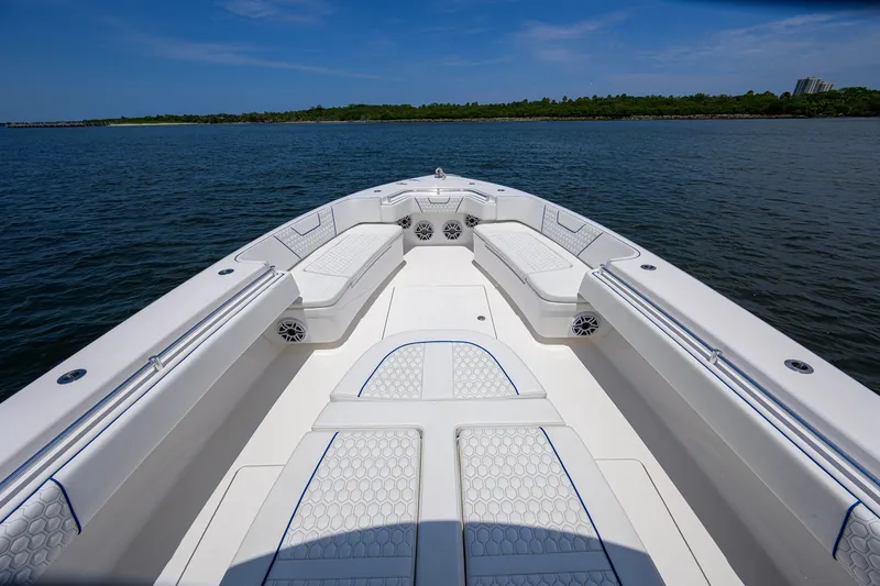 Slide: The Image of 2023 Contender 44 ST boat with spacious seating on calm water. - 18