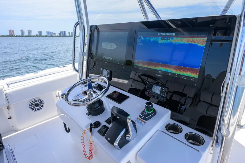 Slide: The Image of Cockpit of 2023 Contender 44 ST boat with advanced navigation displays. - 30