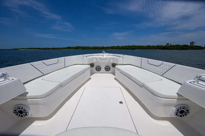 Slide: The Image of Luxurious 2023 Contender 44 ST boat interior with spacious seating and scenic ocean view. - 19