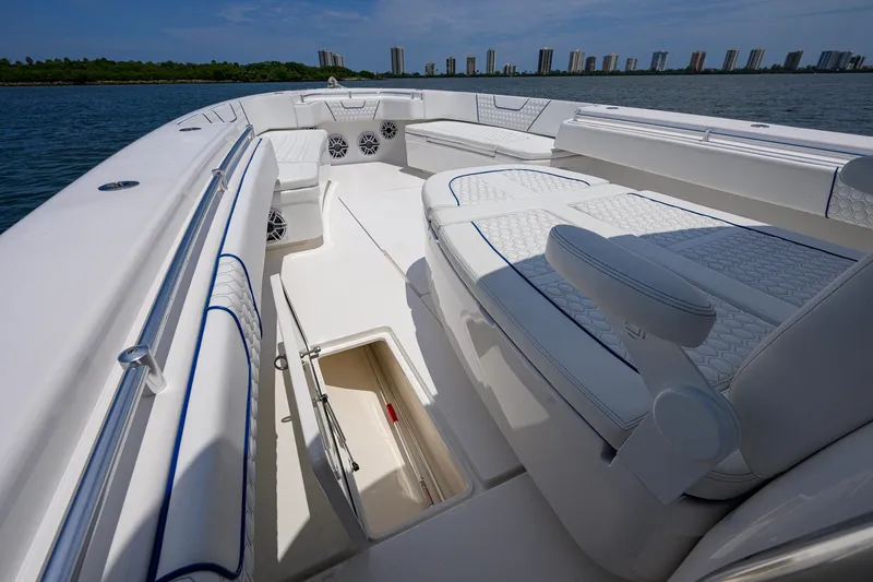 Slide: The Image of 2023 Contender 44 ST boat interior with luxurious seating and ocean view. - 21
