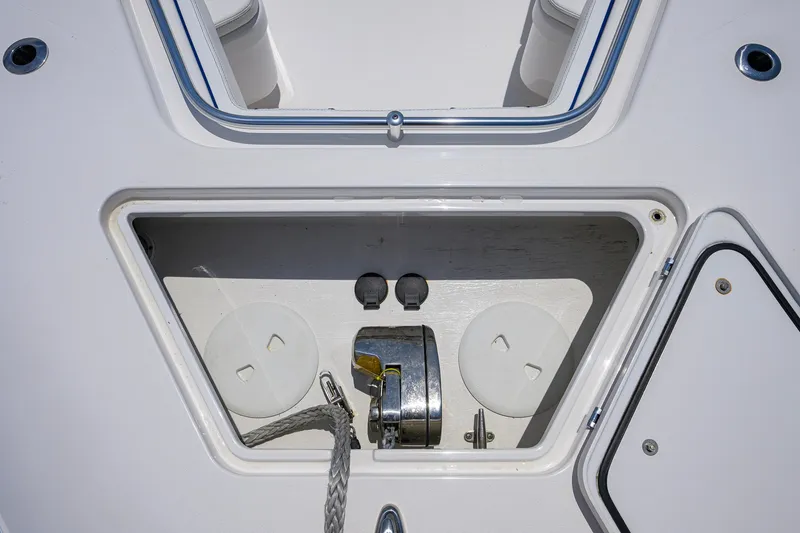 Slide: The Image of Anchor storage compartment on a 2023 Contender 44 ST boat deck. - 22