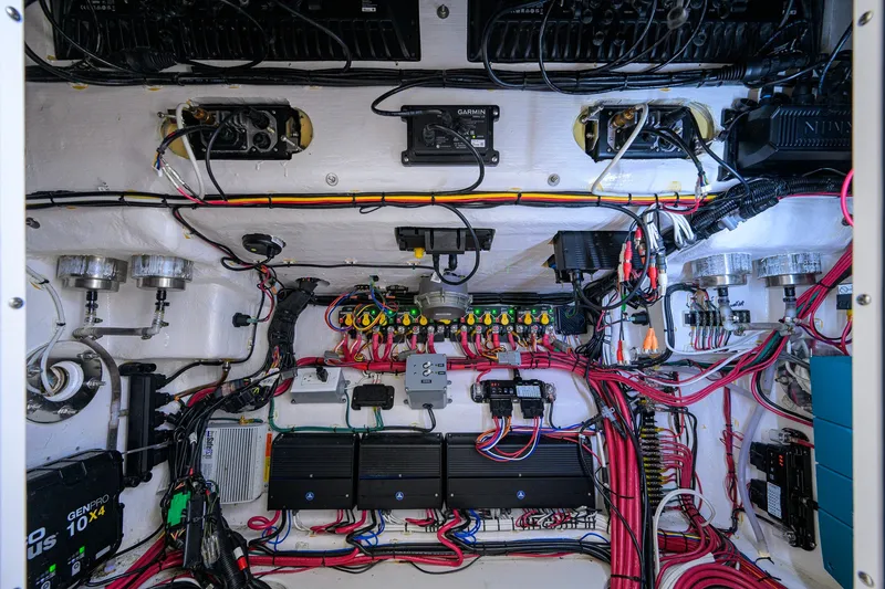 Slide: The Image of Electrical system inside a 2023 Contender 44 ST boat, showcasing wiring and components. - 67