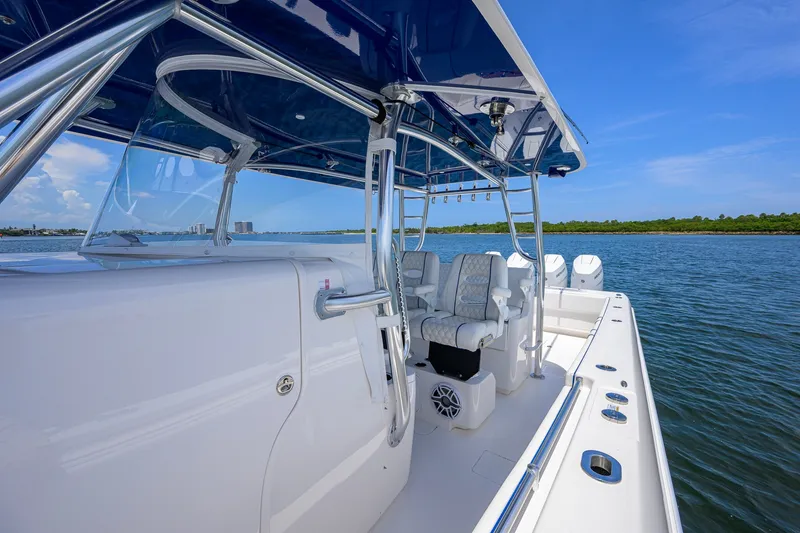 Slide: The Image of 2023 Contender 44 ST boat interior with sleek seating and ocean view. - 15