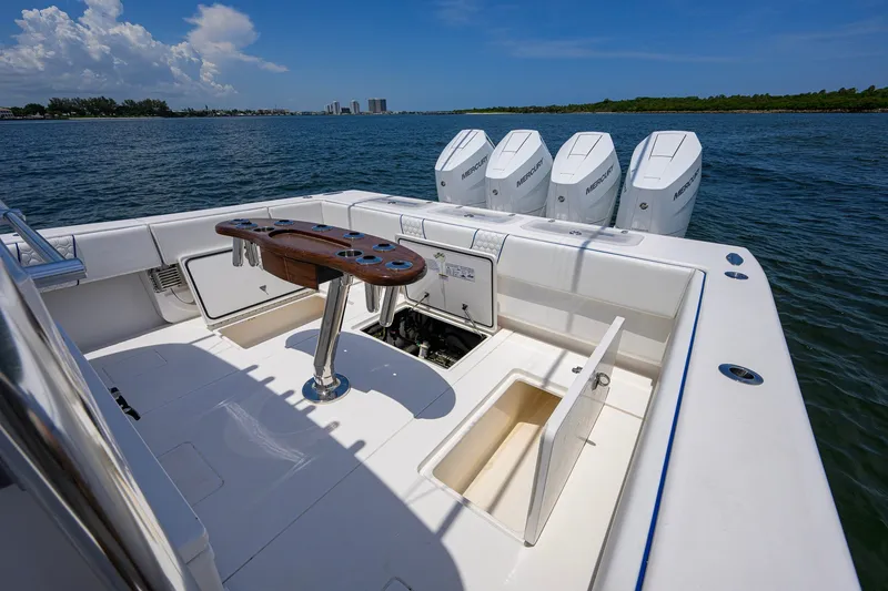 Slide: The Image of 2023 Contender 44 ST boat with quad Mercury engines on open water. - 59
