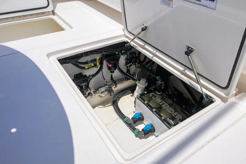Slide: The Image of 2023 Contender 44 ST boat compartment showcasing internal components and wiring. - 57