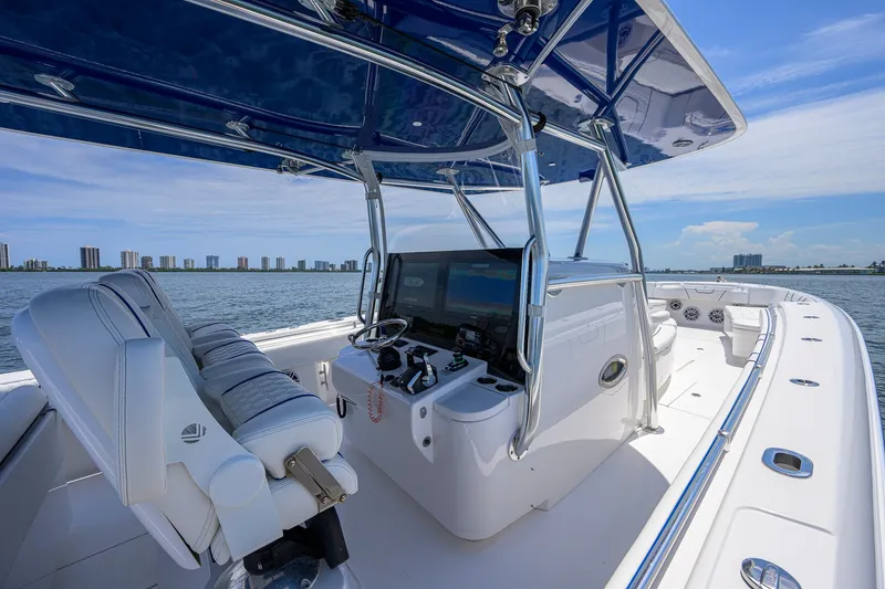 Slide: The Image of 2023 Contender 44 ST boat interior with modern helm and ocean view. - 31