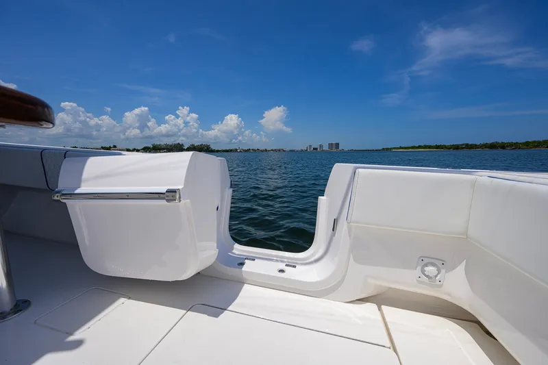 Slide: The Image of 2023 Contender 44 ST boat interior with ocean view under clear blue sky. - 50