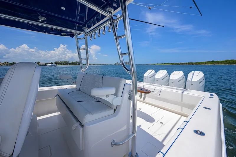 Slide: The Image of 2023 Contender 44 ST boat with four Mercury engines on a sunny day. - 36