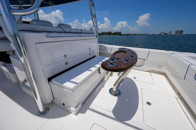 Slide: The Image of 2023 Contender 44 ST boat interior with seating and rod holders, ocean view. - 46