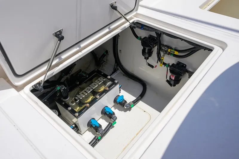 Slide: The Image of Open hatch of 2023 Contender 44 ST boat showing internal components and wiring. - 56