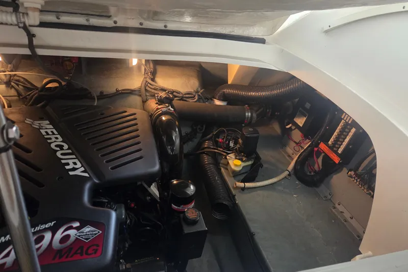 Slide: The Image of Engine compartment of a 2001 Sea Ray 290 Bow Rider with Mercury 496 MAG engine. - 21