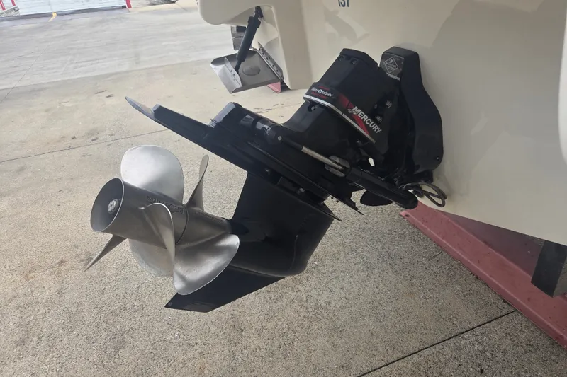 Slide: The Image of Outboard motor of a 2001 Sea Ray 290 Bow Rider boat on a concrete surface. - 8