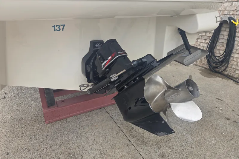 Slide: The Image of Rear view of a 2001 Sea Ray 290 Bow Rider boat with Mercury outdrive. - 7
