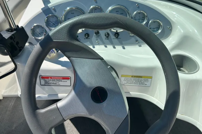 Slide: The Image of Steering wheel and dashboard of 2011 Bayliner 175 Bowrider boat. - 3