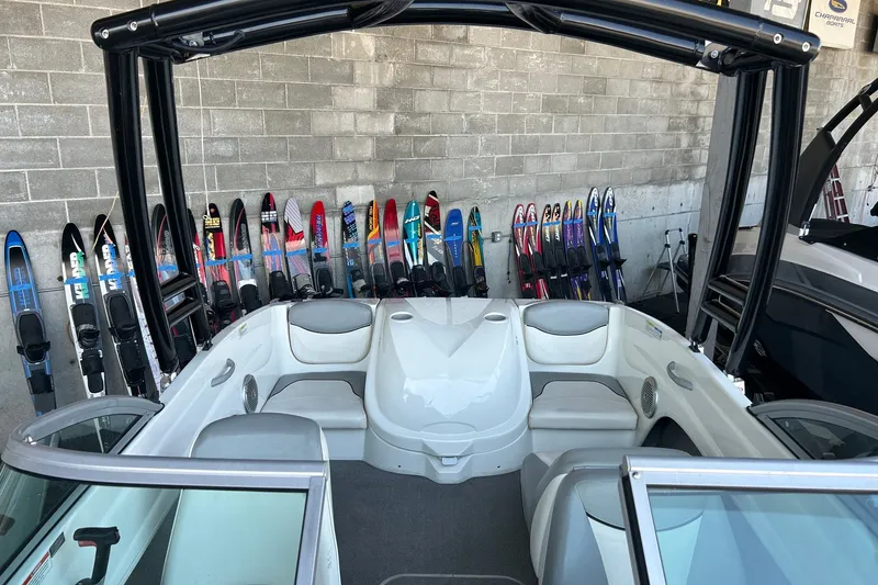 Slide: The Image of 2011 Bayliner 175 Bowrider interior with water skis in background. - 9