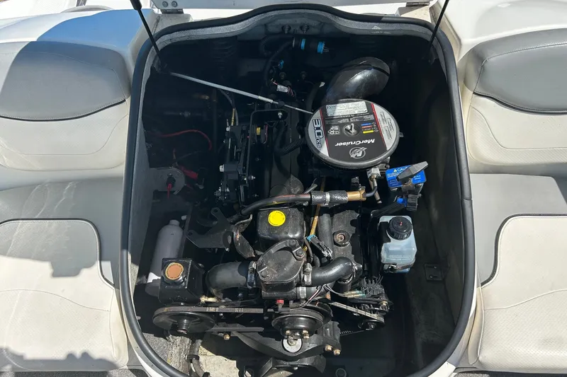 Slide: The Image of Engine compartment of a 2011 Bayliner 175 Bowrider boat, featuring a MerCruiser engine. - 11