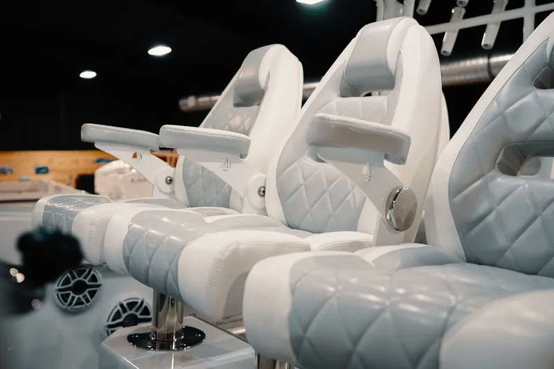 Slide: The Image of Luxurious white leather seats on a 2023 Freeman 42LR boat interior. - 69