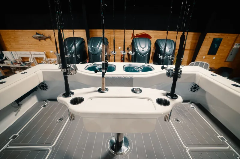 Slide: The Image of Fishing setup on a 2023 Freeman 42LR boat with multiple rods and engines. - 44