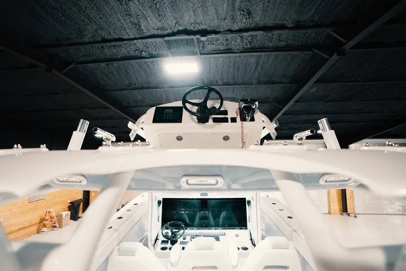 Slide: The Image of Interior view of a 2023 Freeman 42LR boat, showcasing the helm and seating area. - 65