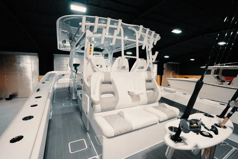 Slide: The Image of 2023 Freeman 42LR boat interior with seating and fishing rod holders. - 50