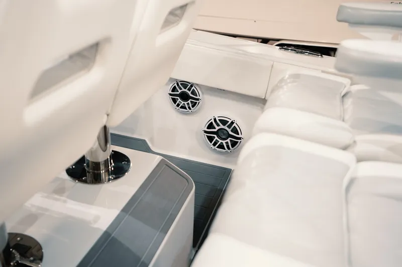 Slide: The Image of Interior of 2023 Freeman 42LR boat with white seating and built-in speakers. - 74