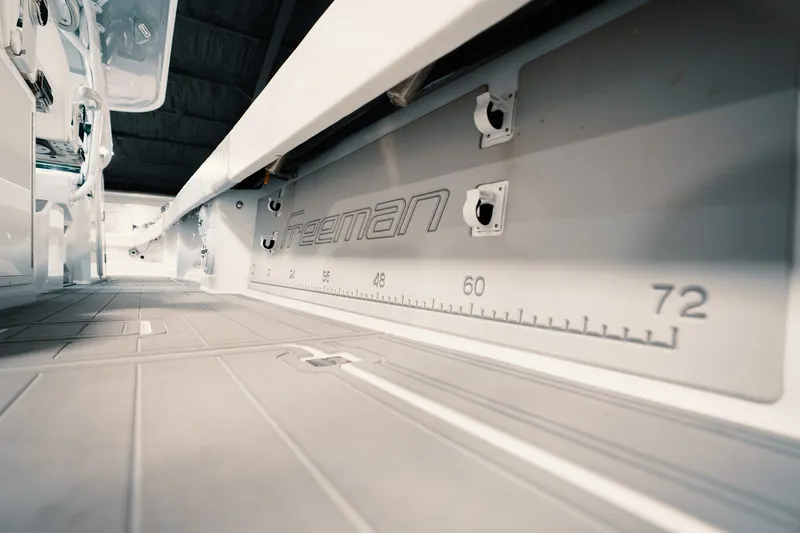 Slide: The Image of Interior view of 2023 Freeman 42LR boat, featuring measurement markings and sleek design. - 55